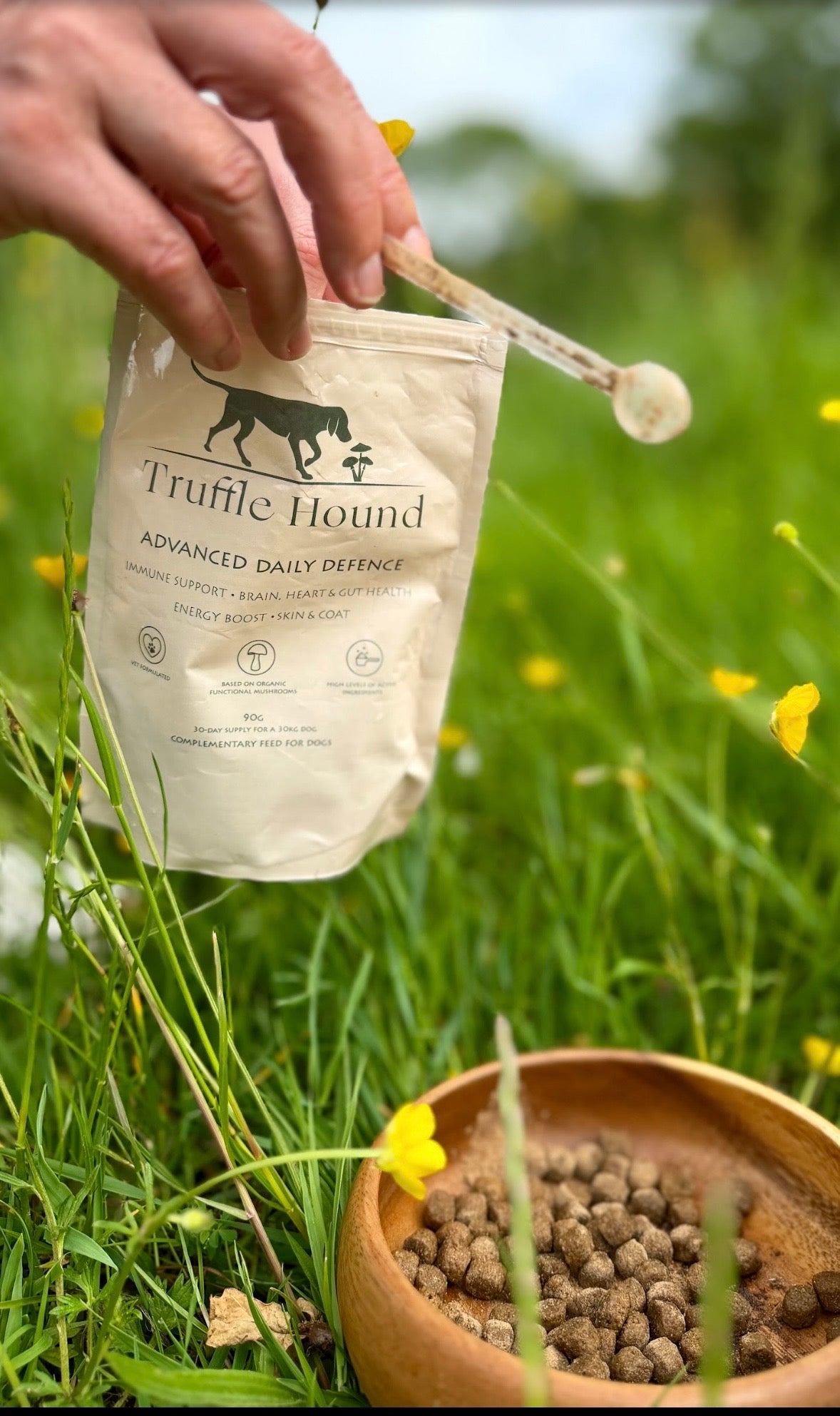 Truffle Hound Advanced Daily Defence beside a dog food bowl
